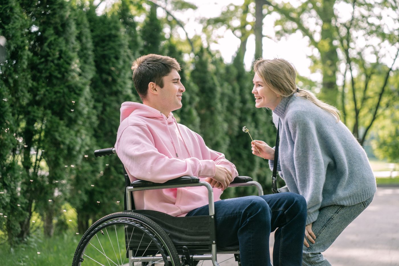NDIS participant and support worker sharing a happy moment outdoors